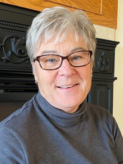 Denise Fandel headshot, with short hair and dark glasses wearing a turtleneck. Denise Fandel headshot, with short hair and dark glasses wearing a turtleneck.